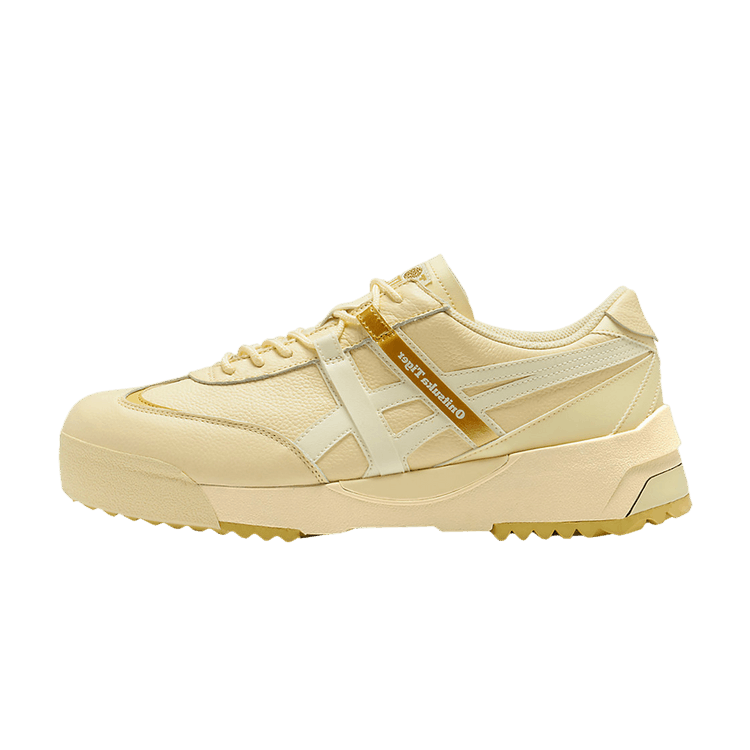 Onitsuka Tiger Delegation EX Beige Cream, zijaanzicht met beige leer, gouden accentstrepen en geribbelde zool