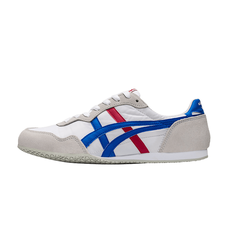 Onitsuka Tiger Serrano White Directoire Blue Red, zijaanzicht met wit leer, blauwe en rode streepen, suèdeleuken, haklabel