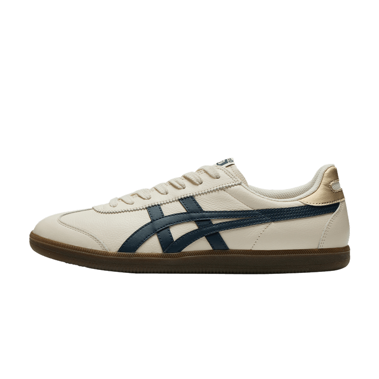 Onitsuka Tiger Tokuten Birch Iron Navy Gum, zijaanzicht sneaker met crème leren upper, donkerblauwe zijstreep en bruingomzool