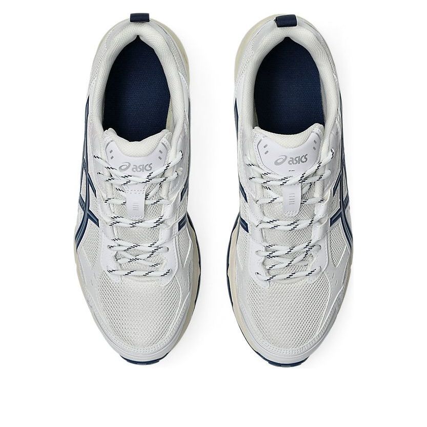 ASICS Gel-Nunobiki White Independence Blue, bovenaanzicht toont vetersluiting en mesh-textuur met donkerblauwe accent