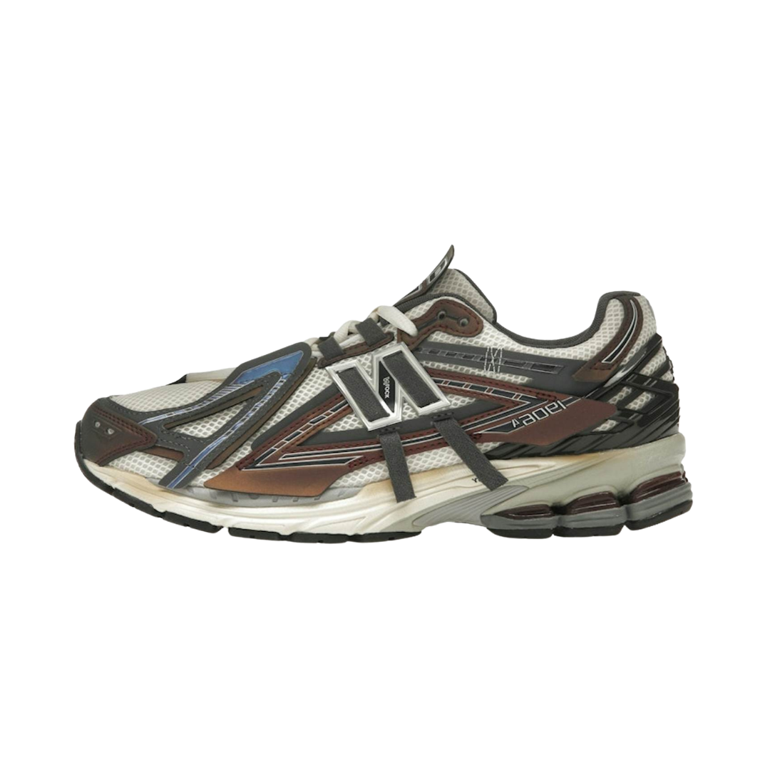 New Balance 1906A Eggplant zijaanzicht met wit mesh, bruin en paars accenten