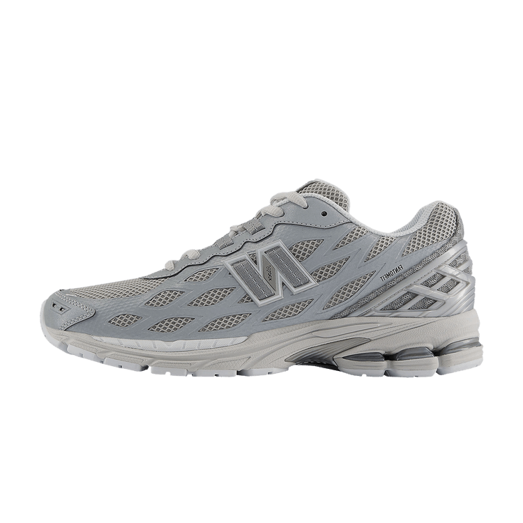 New Balance 1906W Silver Metallic zijaanzicht, grijs mesh met reflecterende accenten en witte zool