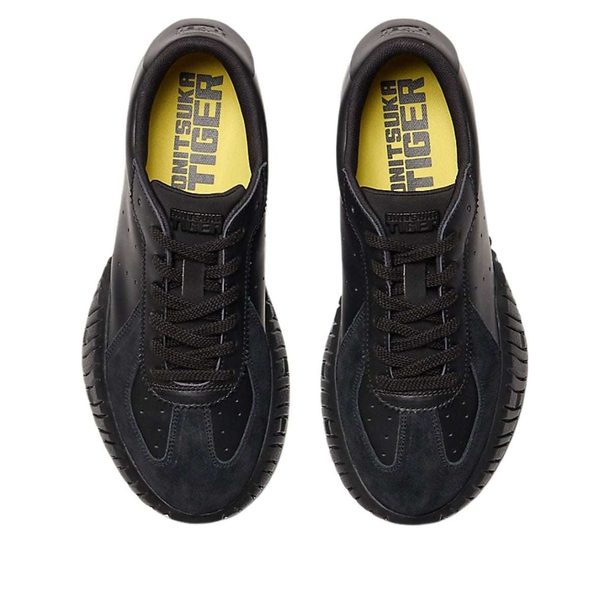 Onitsuka Tiger Duck Tiger TR Black, bovenaanzicht met geel accent in voering en vetering